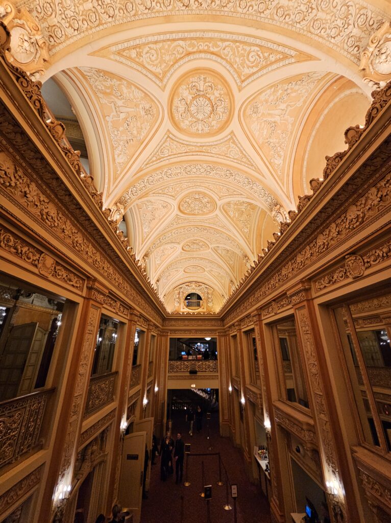 Musical Theatre interior showing a white and gold ceiling.