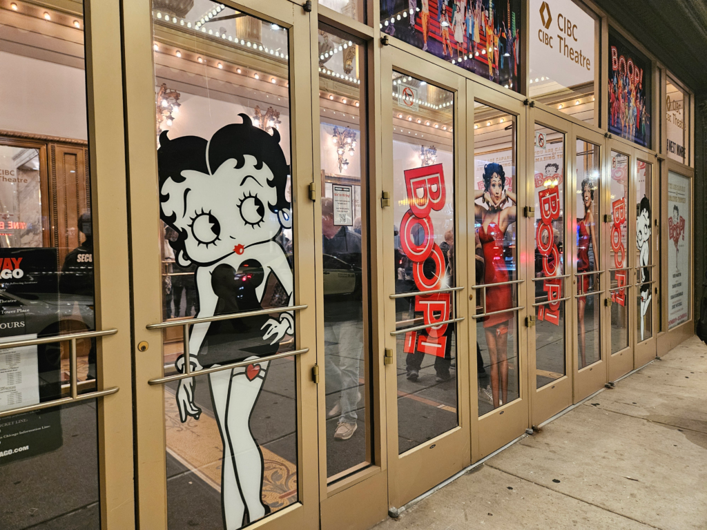 The doors at CIBC Theatre in Chicago with life-sized images of Betty Boop the character with Betty Boop lead actress Jasmine Amy Rogers in character.